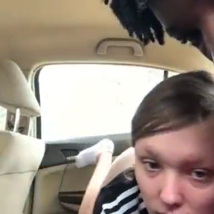 Young couple having fun in car